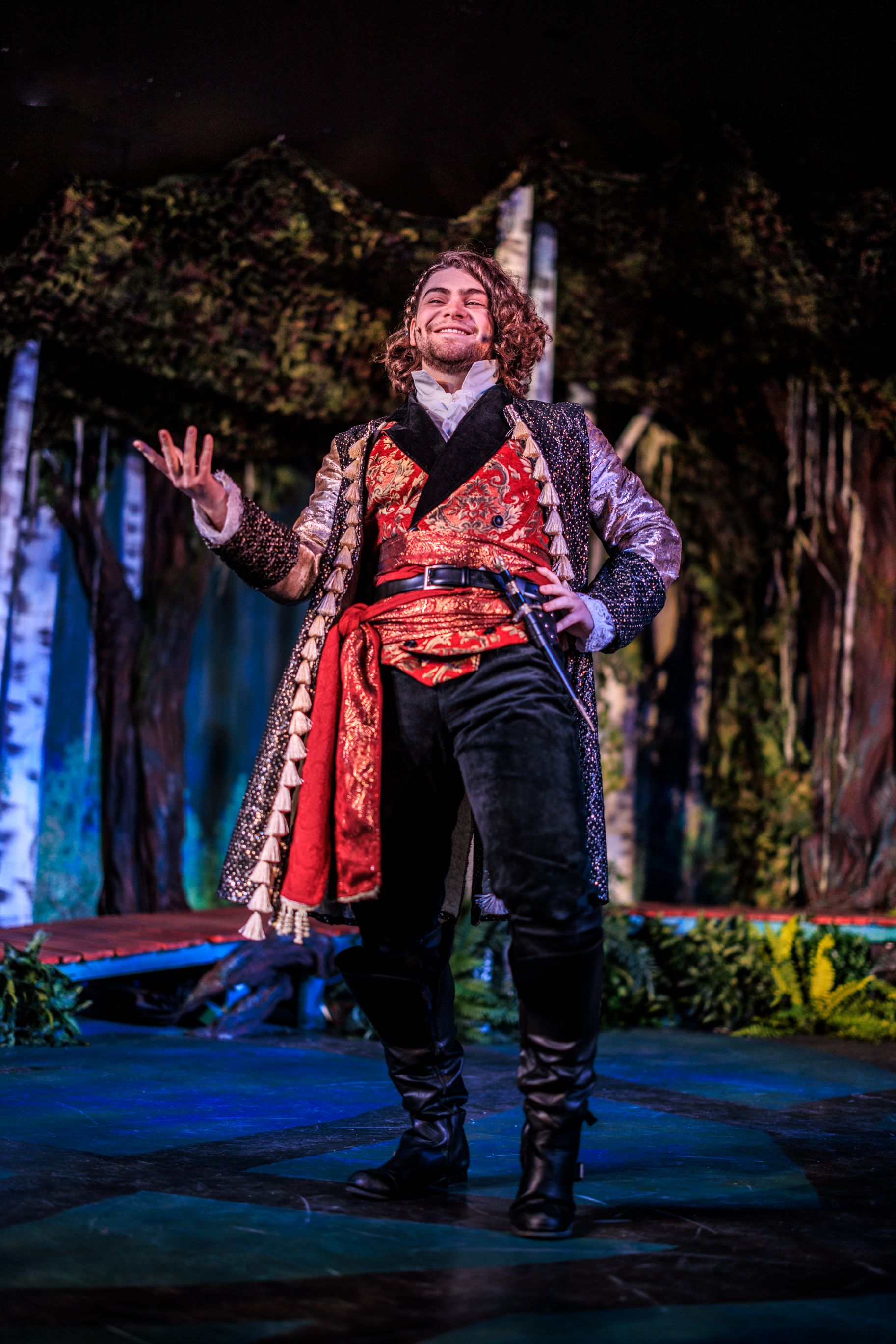 Performing in an ornate red-and-gold coat